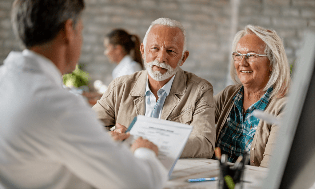 older couple with financial advisor