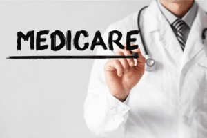 doctor writing medicare