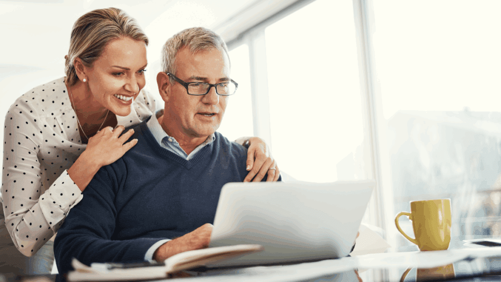 A couple looking on their retirement blueprint, happy that starting early was on the top of their list.
